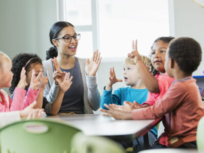 Preschool teacher and students in class